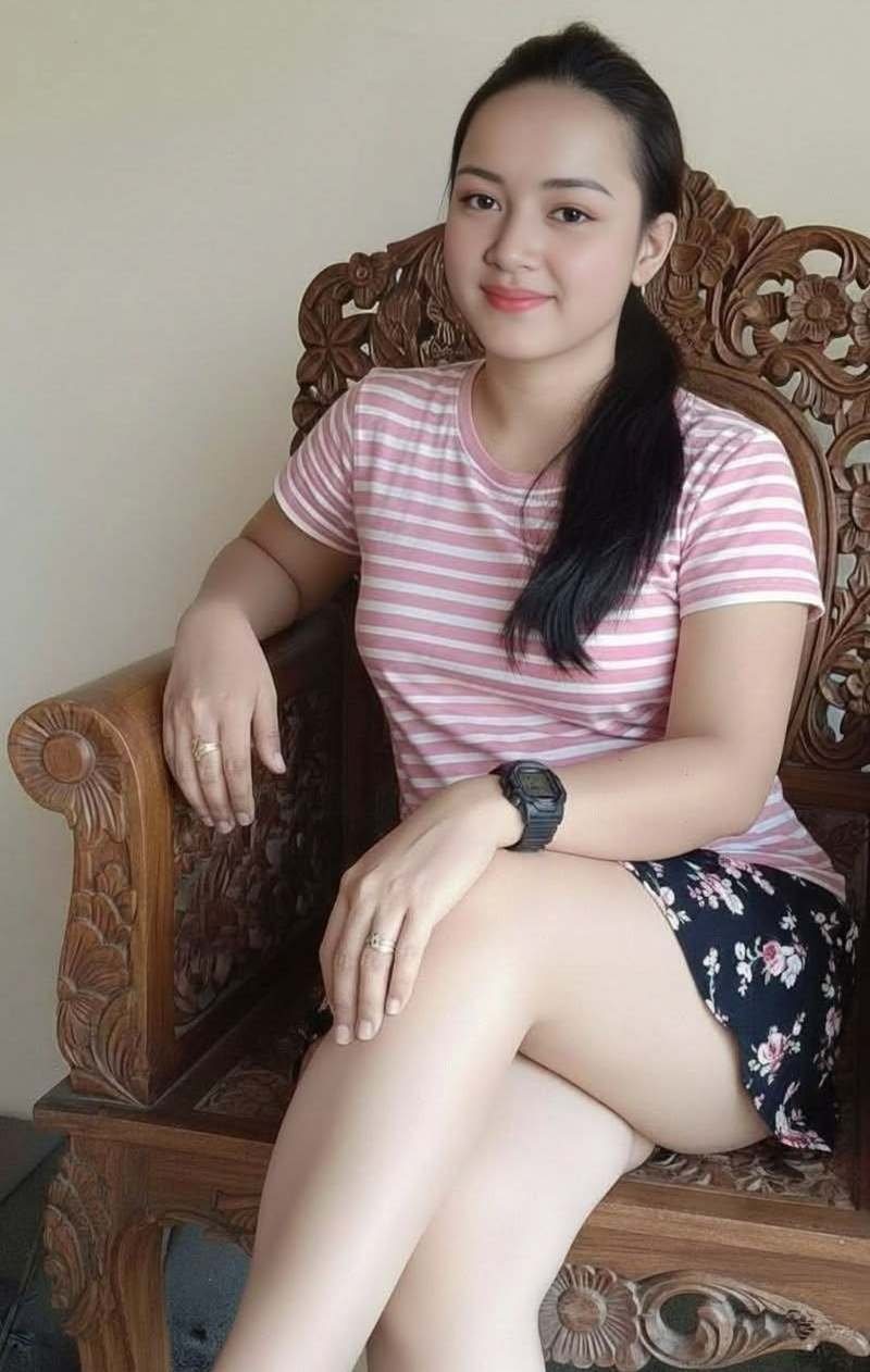Private massage therapist seated in a carved chair at Luxury Asian Massage London