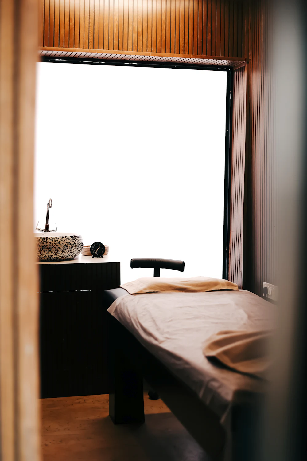 Calm massage treatment room for relaxing Asian massage in central London